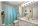 Clean bathroom with light blue shower curtain at 696 Caribbean Dr, Lakeland, FL 33803