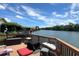Relaxing deck with river views, cushions, and a fire pit at 696 Caribbean Dr, Lakeland, FL 33803