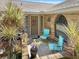 Small patio with two chairs and potted plants at 696 Caribbean Dr, Lakeland, FL 33803