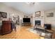 Living room with hardwood floors, fireplace, and wet bar at 696 Caribbean Dr, Lakeland, FL 33803