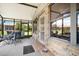 Screened porch with brick wall and patio furniture at 696 Caribbean Dr, Lakeland, FL 33803