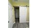 Hallway with barn door and updated flooring at 10742 W Beach Pkwy, Lake Wales, FL 33898