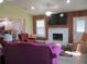 Spacious living room with fireplace and wood accents at 10742 W Beach Pkwy, Lake Wales, FL 33898