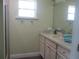 Bathroom with shower, vanity, and updated fixtures at 10742 W Beach Pkwy, Lake Wales, FL 33898