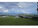 Scenic lakefront property with private dock, lush grass, and serene water views at 10742 W Beach Pkwy, Lake Wales, FL 33898