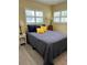 Bedroom with full-size bed and window seating at 10742 W Beach Pkwy, Lake Wales, FL 33898