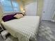 Bedroom with king-size bed and neutral decor at 10742 W Beach Pkwy, Lake Wales, FL 33898