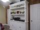 White built-in shelving unit with ample storage space at 10742 W Beach Pkwy, Lake Wales, FL 33898
