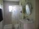Updated bathroom with shower, vanity, and a large mirror at 10742 W Beach Pkwy, Lake Wales, FL 33898