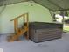 Hot tub with wooden steps under a covered patio at 10742 W Beach Pkwy, Lake Wales, FL 33898