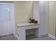 White cabinets and a built-in desk area in the kitchen at 10742 W Beach Pkwy, Lake Wales, FL 33898