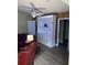 Living room with white built-in shelving and hardwood floors at 10742 W Beach Pkwy, Lake Wales, FL 33898