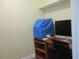 Efficient home office with desk, computer, and ample shelving at 10742 W Beach Pkwy, Lake Wales, FL 33898