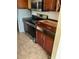 View of kitchen with stainless steel appliances and wood cabinets at 417 Bay Leaf Dr, Kissimmee, FL 34759