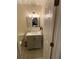 Modern bathroom with updated vanity and mirror at 535 Minnow Ct, Kenansville, FL 34739