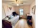 Cozy bedroom with daybed, dresser, and charming wall art at 535 Minnow Ct, Kenansville, FL 34739