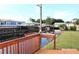 Relaxing view of the canal from a wooden deck with a small sink at 535 Minnow Ct, Kenansville, FL 34739
