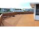 Spacious deck with concrete surface and wooden railing at 535 Minnow Ct, Kenansville, FL 34739