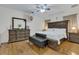 Spacious main bedroom with large bed, dresser, and wood floors at 1801 Stargazer Trl, Kissimmee, FL 34758