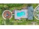 Community pool with surrounding lounge chairs and playground at 1801 Stargazer Trl, Kissimmee, FL 34758