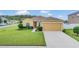 Single-story home with attached garage and well-maintained lawn at 1801 Stargazer Trl, Kissimmee, FL 34758