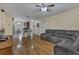Bright living room with hardwood floors and a comfortable sectional sofa at 1801 Stargazer Trl, Kissimmee, FL 34758