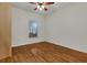 Bright bedroom with wood floors and a ceiling fan at 1801 Stargazer Trl, Kissimmee, FL 34758
