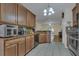 Modern kitchen with dark wood cabinets and breakfast bar at 1801 Stargazer Trl, Kissimmee, FL 34758