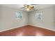 Well-lit bedroom with hardwood floors and ceiling fan at 2800 S Park Ave, Sanford, FL 32773
