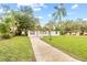 White house with driveway and landscaped yard at 2800 S Park Ave, Sanford, FL 32773