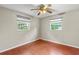 Bedroom with hardwood floors and two windows at 2800 S Park Ave, Sanford, FL 32773