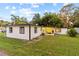 White house with screened porch and grassy yard at 2800 S Park Ave, Sanford, FL 32773