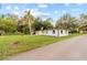 White house with driveway and green lawn at 2800 S Park Ave, Sanford, FL 32773