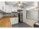 Modern kitchen with white cabinets and granite countertops at 2800 S Park Ave, Sanford, FL 32773