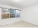 Bright bedroom with tile floors and large window at 2800 S Park Ave, Sanford, FL 32773