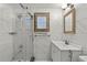 Clean bathroom with white tiled walls, shower, and vanity at 2800 S Park Ave, Sanford, FL 32773
