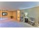 Spacious living room with light carpeting and two armchairs at 8872 Sw 92Nd Pl # E, Ocala, FL 34481