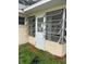 Exterior view of sunroom with window and door at 8872 Sw 92Nd Pl # E, Ocala, FL 34481