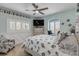 Cozy bedroom with a seashell-themed bedding and window seat at 444 Quay Assisi, New Smyrna Beach, FL 32169