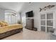 Main bedroom with yellow bedding, dresser, and large TV at 444 Quay Assisi, New Smyrna Beach, FL 32169