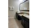 Double vanity bathroom with granite countertops at 8157 Roseville Blvd, Davenport, FL 33896