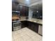 Modern kitchen with stainless steel appliances at 8157 Roseville Blvd, Davenport, FL 33896