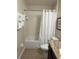 Clean bathroom with tub, shower, and granite countertop at 8157 Roseville Blvd, Davenport, FL 33896
