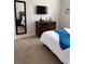 Bedroom with TV, dresser, and full-length mirror at 8157 Roseville Blvd, Davenport, FL 33896
