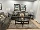 Comfortable living room with brown sofa and coffee table at 8157 Roseville Blvd, Davenport, FL 33896