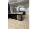 Kitchen with dark wood cabinets and granite counters at 8157 Roseville Blvd, Davenport, FL 33896