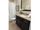 Bathroom with granite vanity, toilet and shower at 8157 Roseville Blvd, Davenport, FL 33896