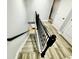 Modern staircase with black iron railing at 8157 Roseville Blvd, Davenport, FL 33896