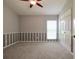 Well-lit bedroom with neutral carpeting and gray accents at 582 Caledonia Pl, Sanford, FL 32771
