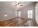 Spacious bedroom with wood-look floors and plantation shutters at 582 Caledonia Pl, Sanford, FL 32771